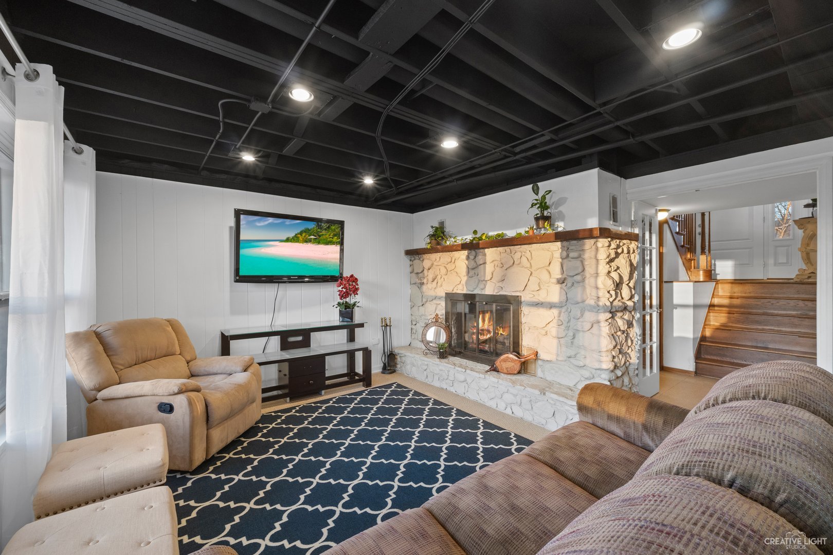4S064 Thornapple Tree Road Sugar Grove, IL 60554 - Photo 23 of 39 a living room with furniture a flat screen tv and a table