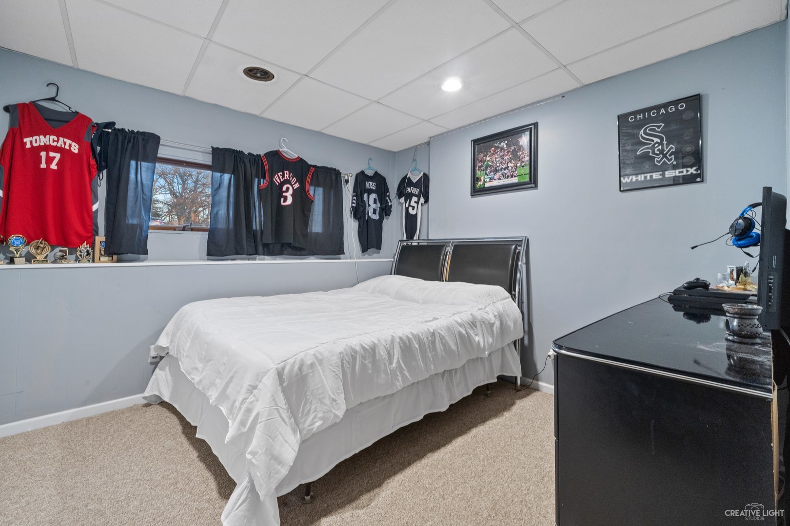 4S064 Thornapple Tree Road Sugar Grove, IL 60554 - Photo 27 of 39 a bedroom with a large bed and a chandelier