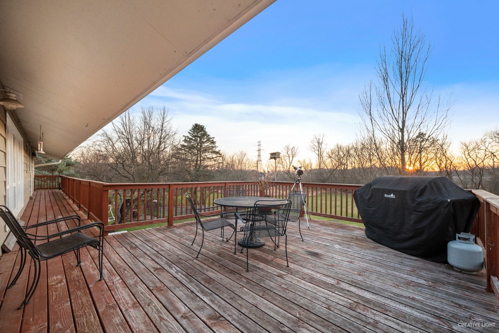 4S064 Thornapple Tree Road Sugar Grove, IL 60554 - Photo 32 of 39 a view of a roof deck with table and chairs a barbeque with wooden floor and fence