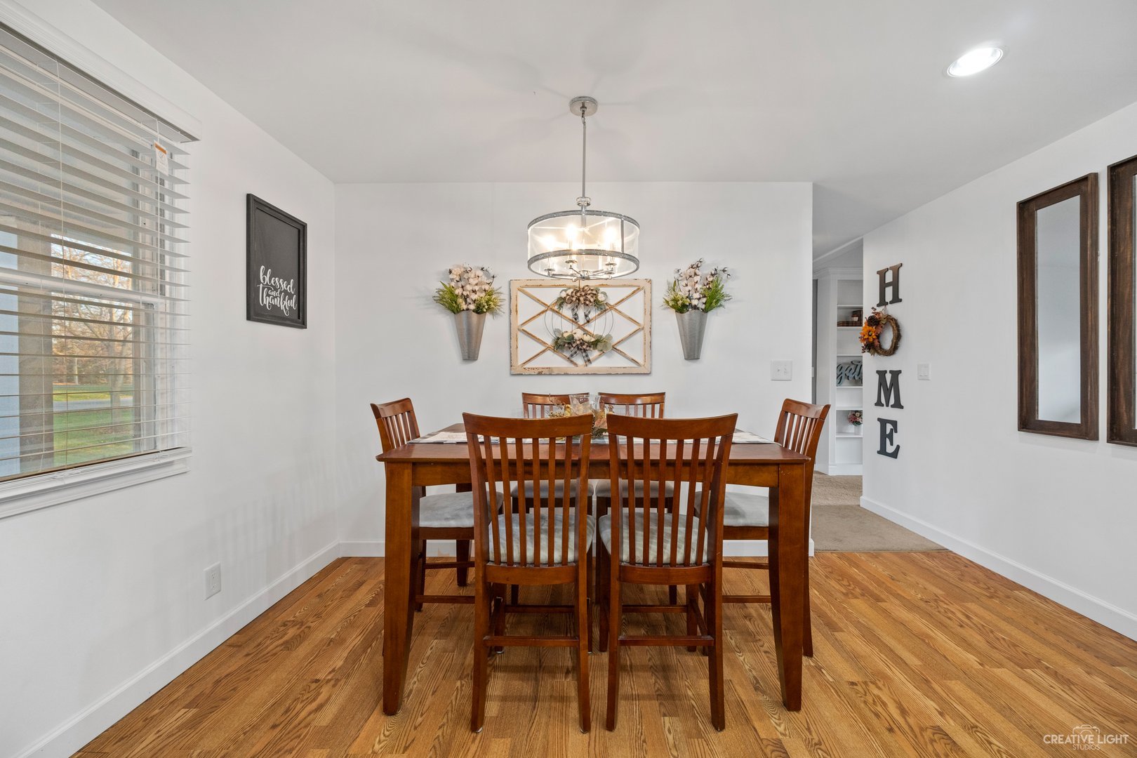 4S064 Thornapple Tree Road Sugar Grove, IL 60554 - Photo 6 of 39 a view of a dining room with furniture window and wooden floor