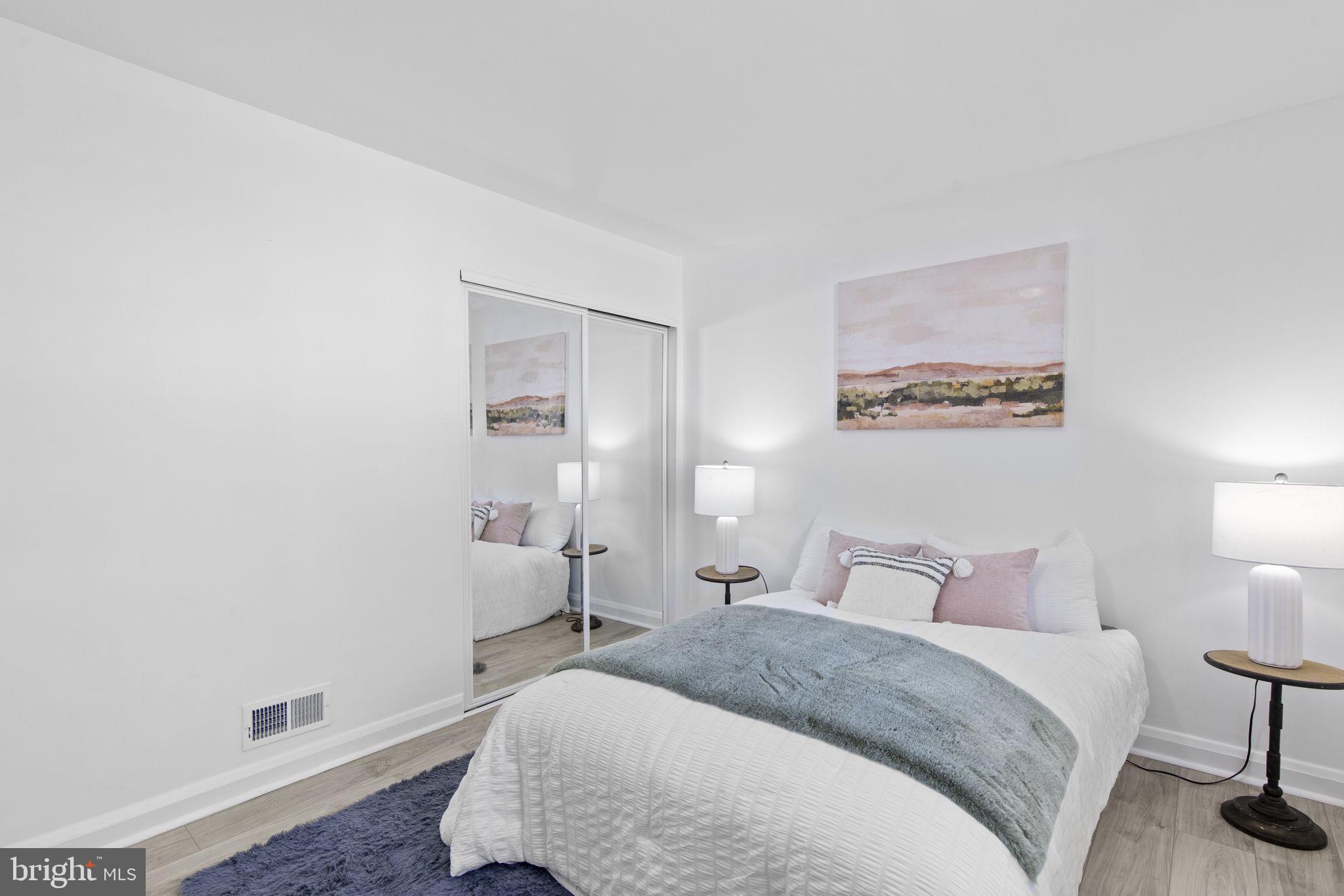 8105 Hillendale Road Baltimore, MD 21234 - Photo 15 of 39 a bedroom with a bed and a lamp