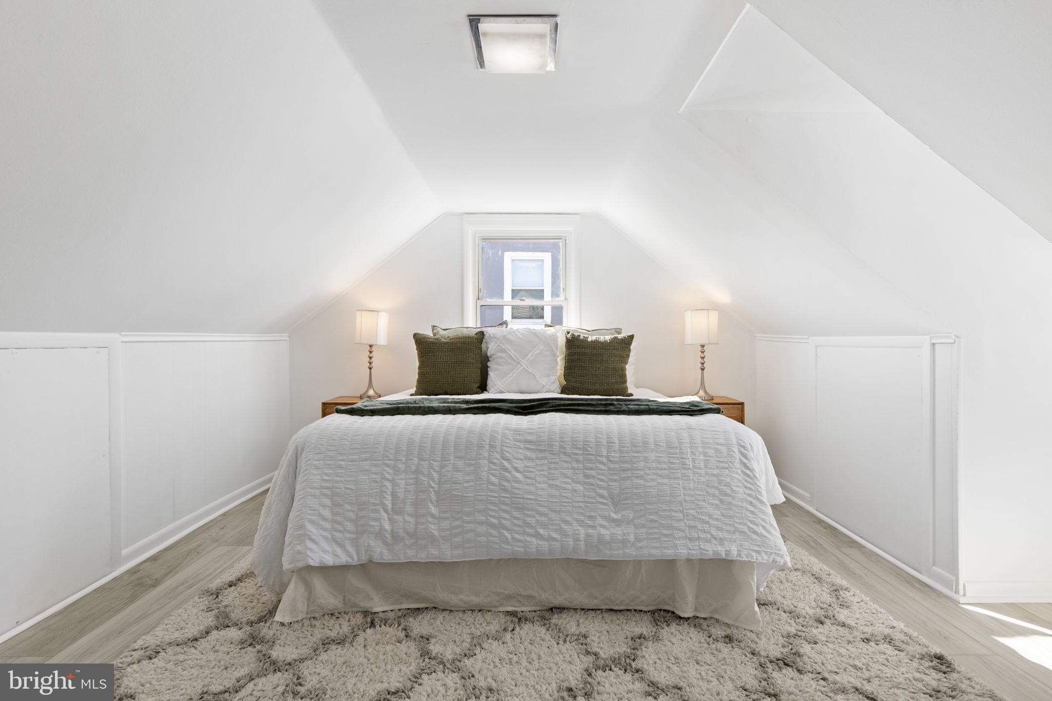 8105 Hillendale Road Baltimore, MD 21234 - Photo 21 of 39 a bedroom with a bed and a wooden floor