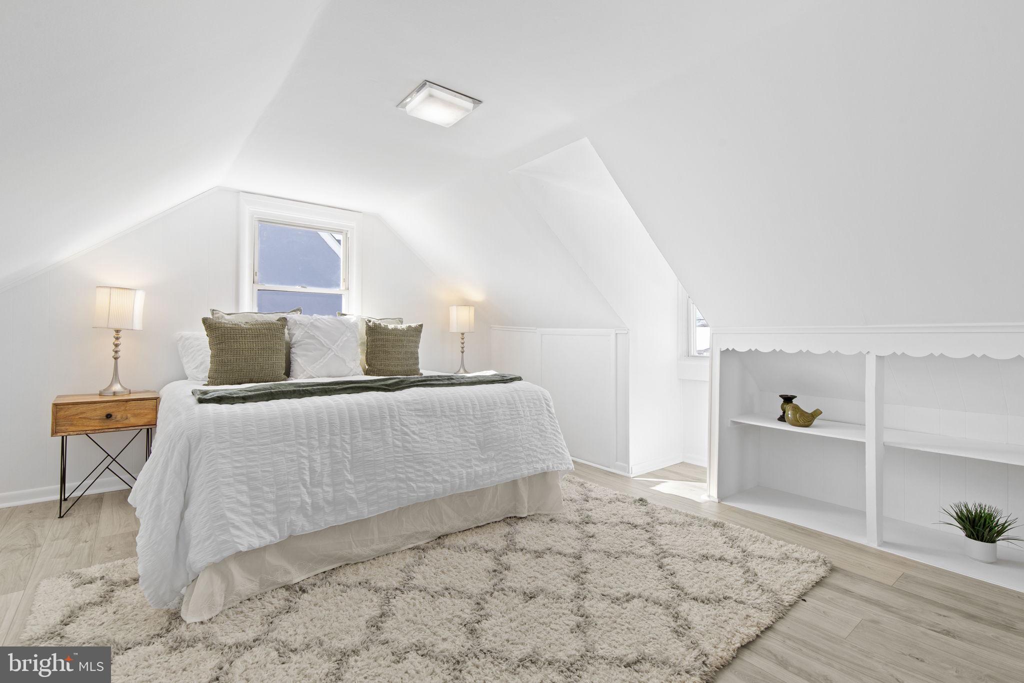 8105 Hillendale Road Baltimore, MD 21234 - Photo 22 of 39 a bedroom with a bed and chair