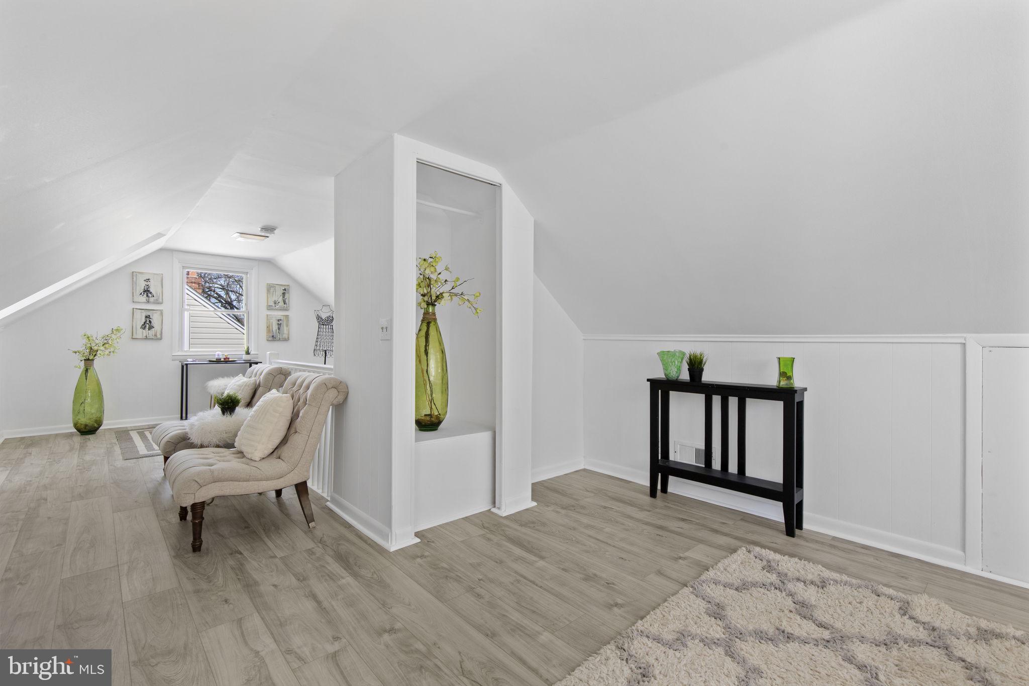 8105 Hillendale Road Baltimore, MD 21234 - Photo 24 of 39 a living room with furniture and a wooden floor