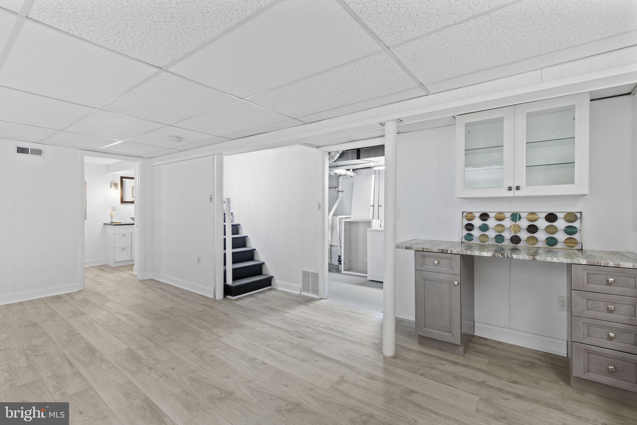 8105 Hillendale Road Baltimore, MD 21234 - Photo 26 of 39 a kitchen with cabinets and wooden floor