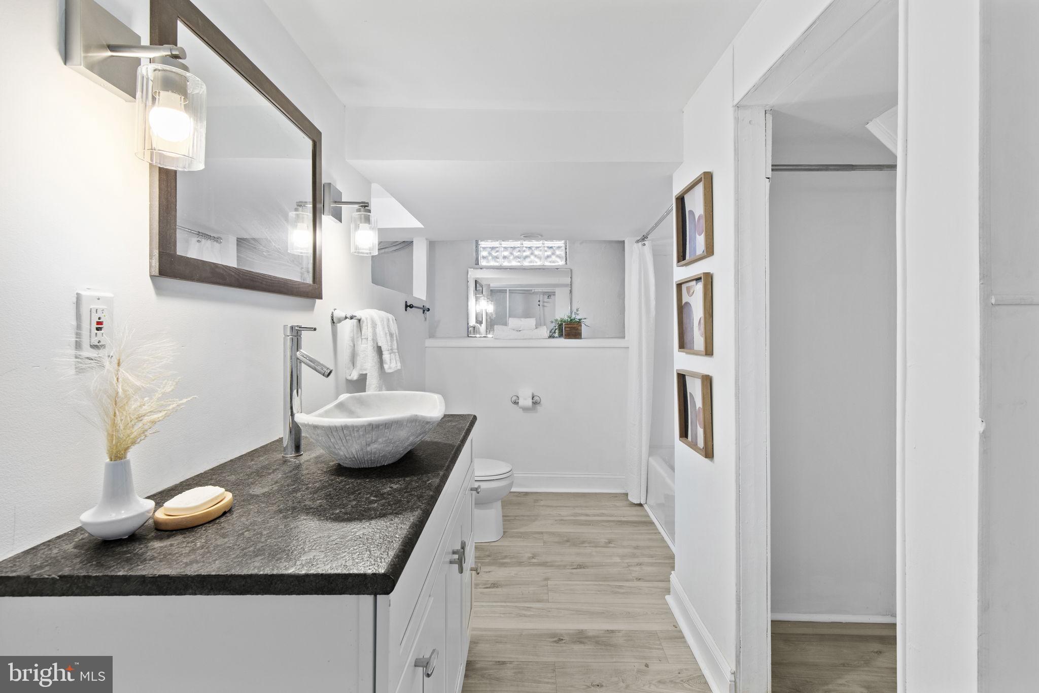 8105 Hillendale Road Baltimore, MD 21234 - Photo 28 of 39 a living room with furniture and a wooden floor
