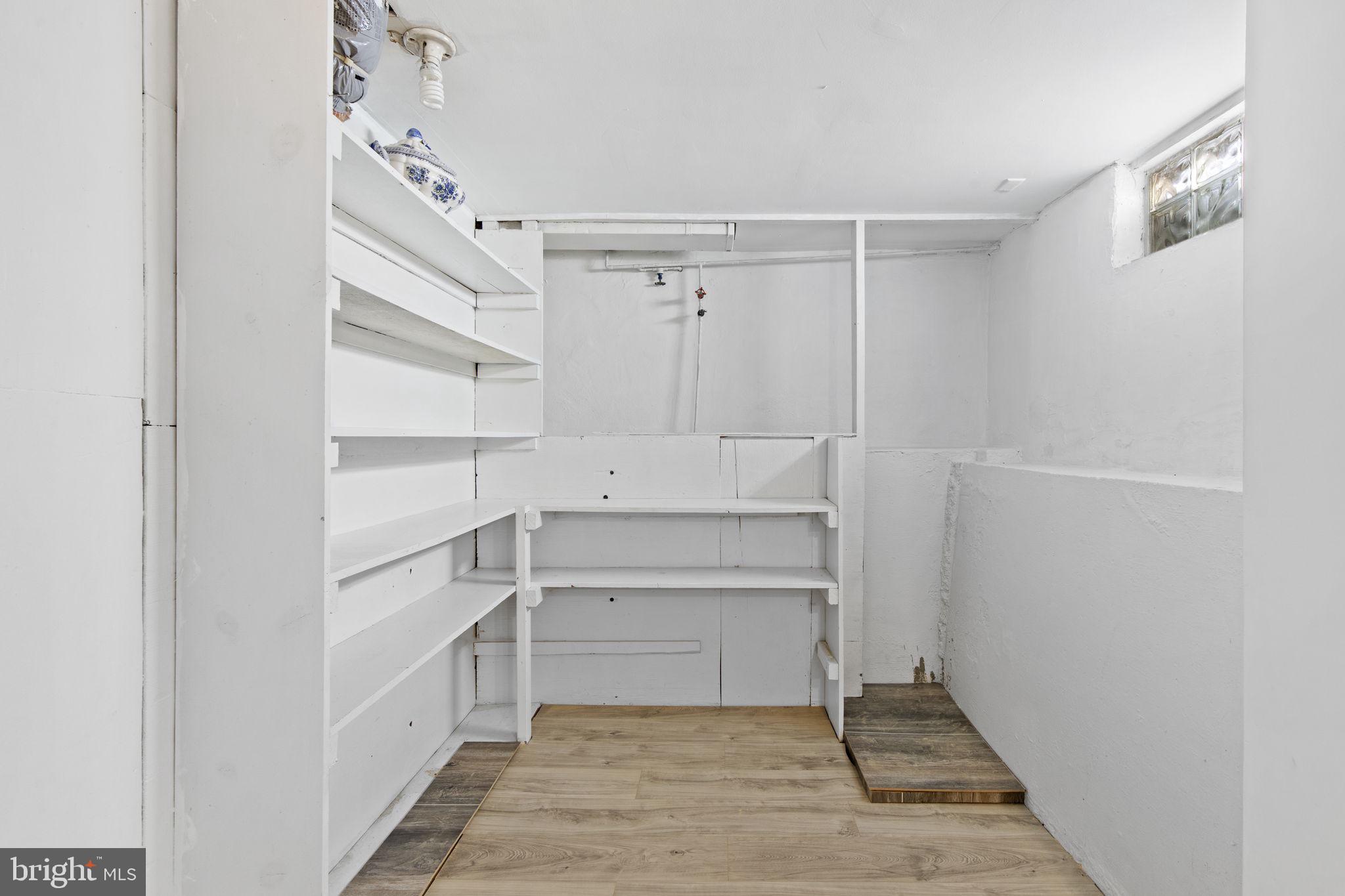 8105 Hillendale Road Baltimore, MD 21234 - Photo 31 of 39 a view of walk in closet with empty racks