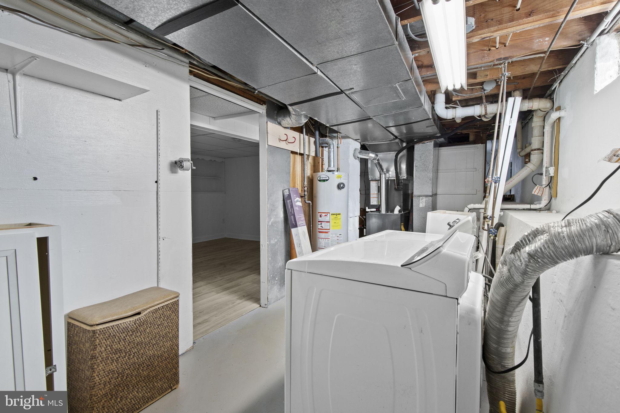 8105 Hillendale Road Baltimore, MD 21234 - Photo 33 of 39 a view of walk in closet with clothes and shoes