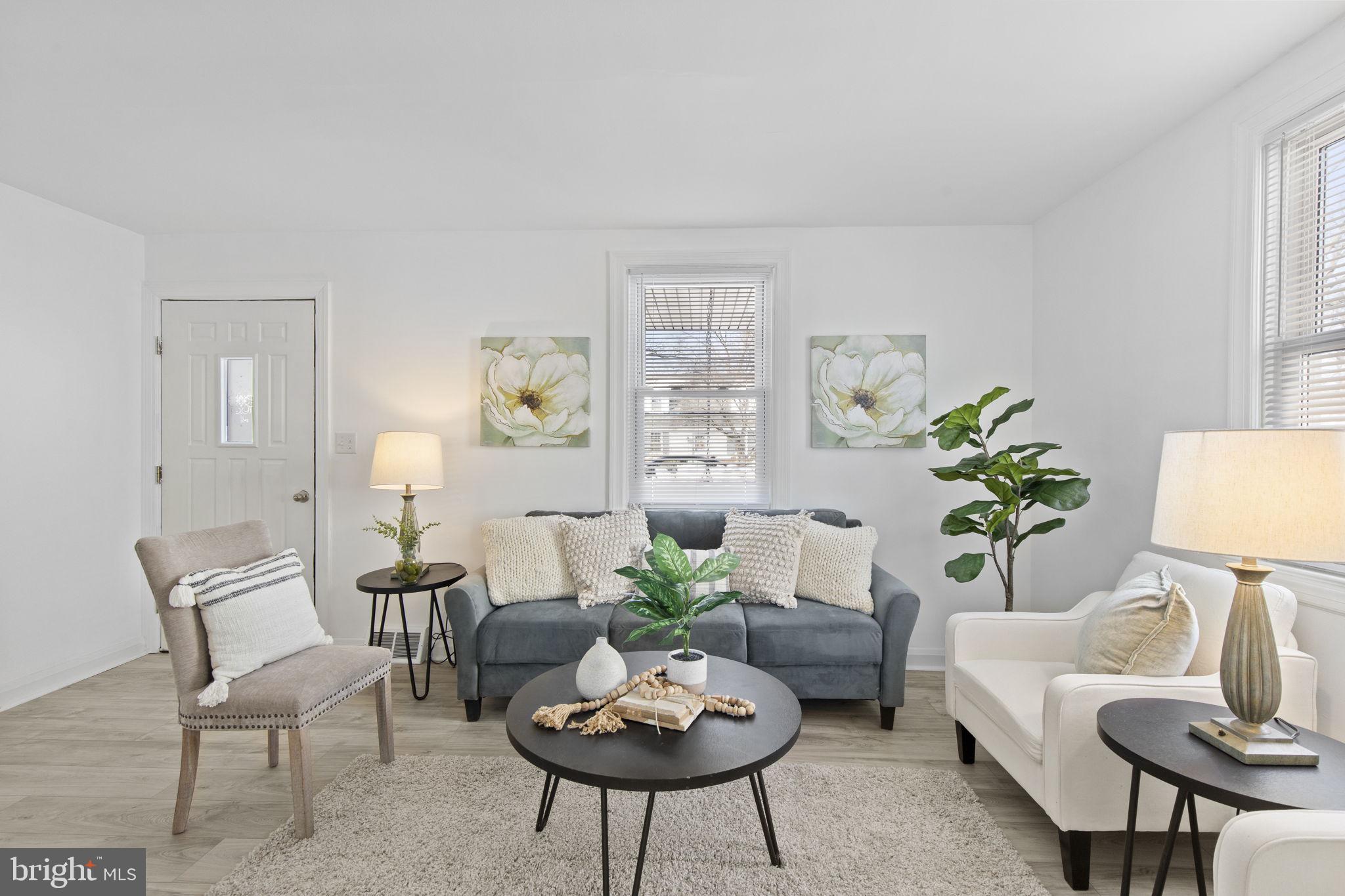 8105 Hillendale Road Baltimore, MD 21234 - Photo 5 of 39 a living room with furniture and a potted plant