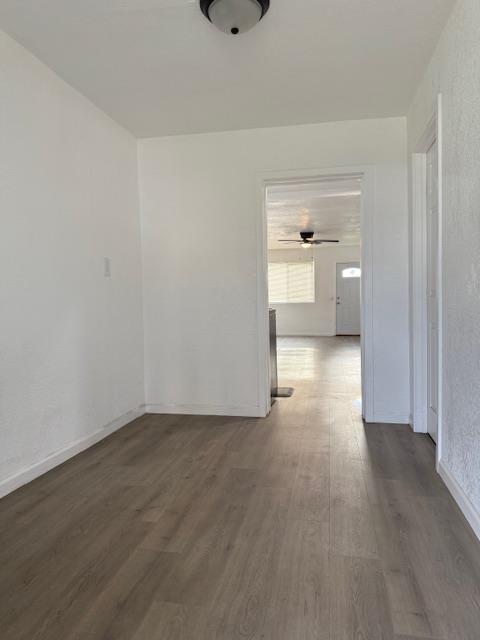 16286 Letteau Avenue Delhi, CA 95315 - Photo 13 of 16 a view of a room with wooden floor and bathroom