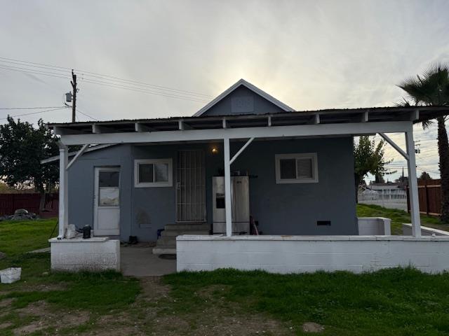 16286 Letteau Avenue Delhi, CA 95315 - Photo 14 of 16 a front view of a house with a yard