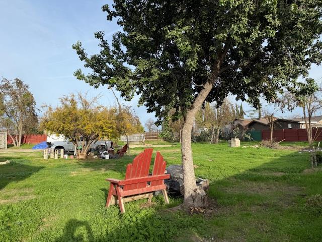 16286 Letteau Avenue Delhi, CA 95315 - Photo 15 of 16 a backyard of a house with table and chairs