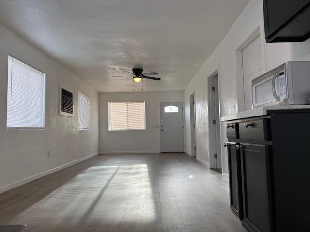 16286 Letteau Avenue Delhi, CA 95315 - Photo 4 of 16 a view of empty room with window and refrigerator