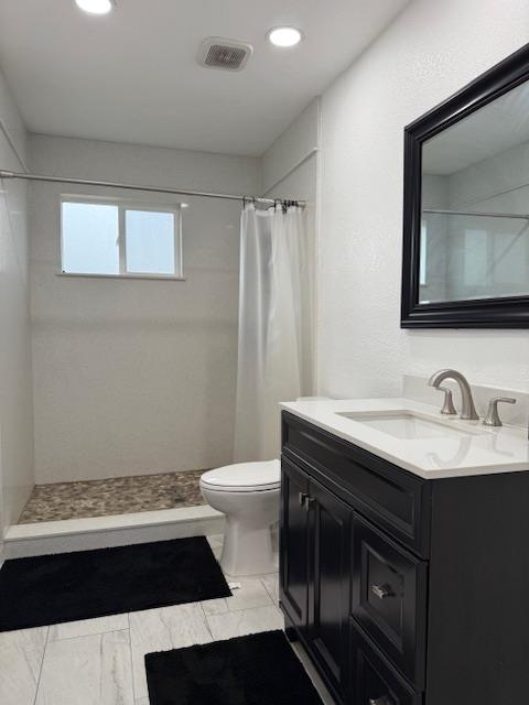 16286 Letteau Avenue Delhi, CA 95315 - Photo 9 of 16 a bathroom with a sink and a toilet