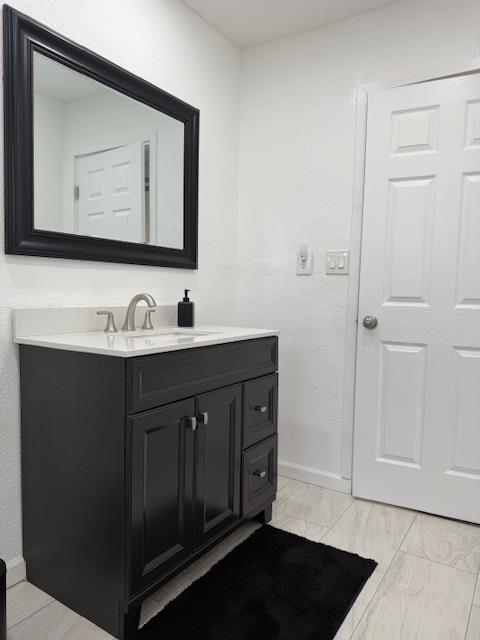16286 Letteau Avenue Delhi, CA 95315 - Photo 10 of 16 a bathroom with a sink and a mirror