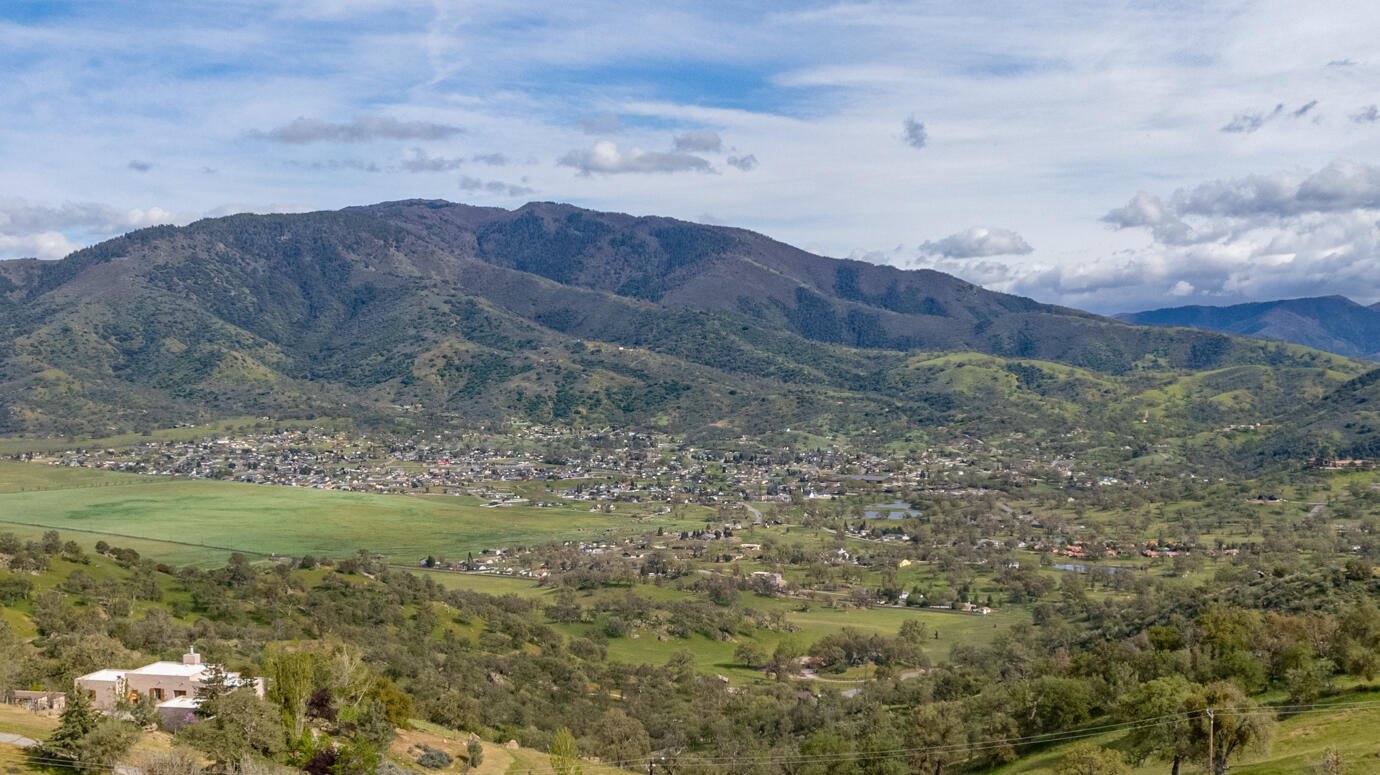 Peregrine Place Tehachapi, CA 93561 - Photo 14 of 16 a view of a lush green hillside and houses