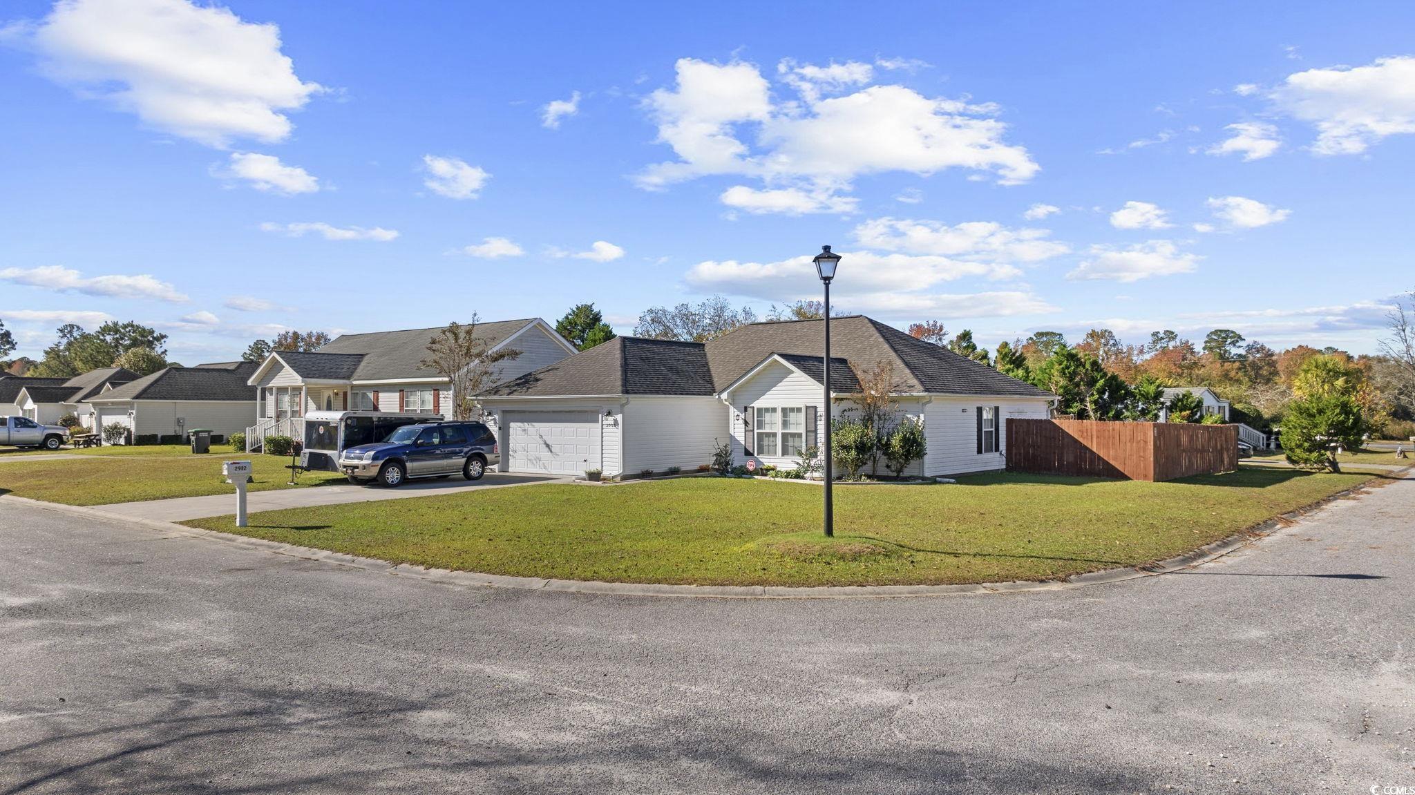 2902 Silverleaf Circle Loris, SC 29569 - Photo 2 of 38 View of front of home featuring concrete driveway and a garage
