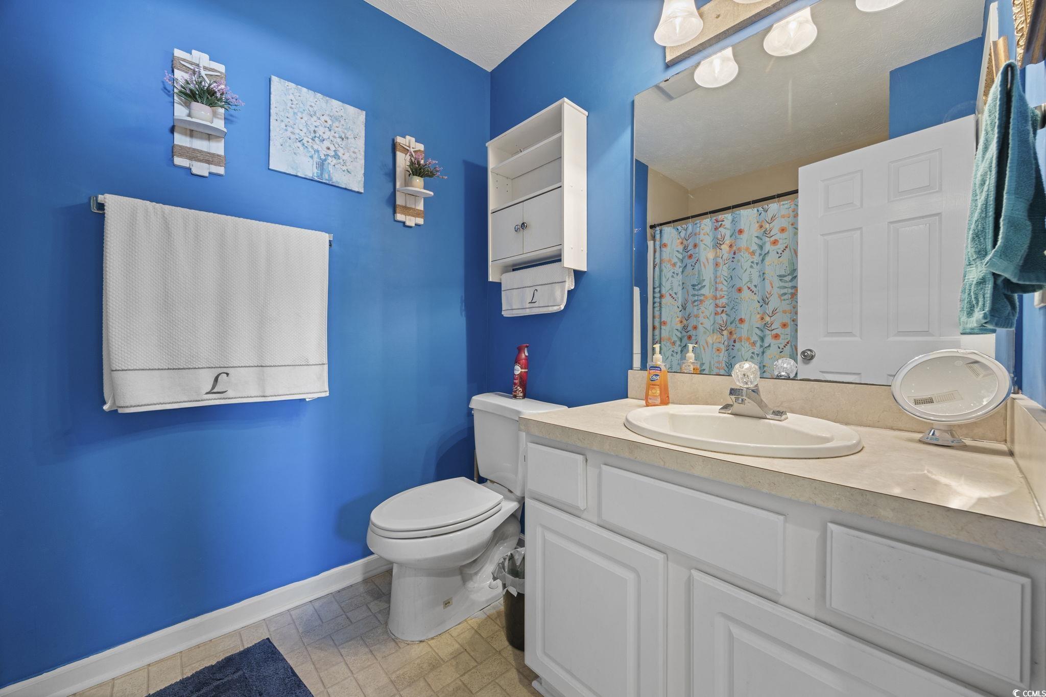 2902 Silverleaf Circle Loris, SC 29569 - Photo 21 of 38 Full bathroom featuring a shower with shower curtain and vanity