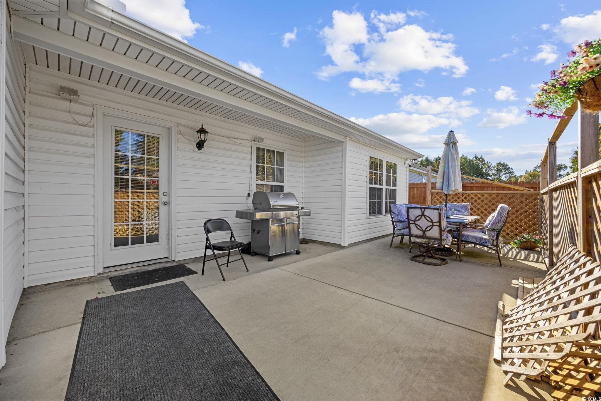 2902 Silverleaf Circle Loris, SC 29569 - Photo 25 of 38 View of patio with area for grilling and outdoor dining space