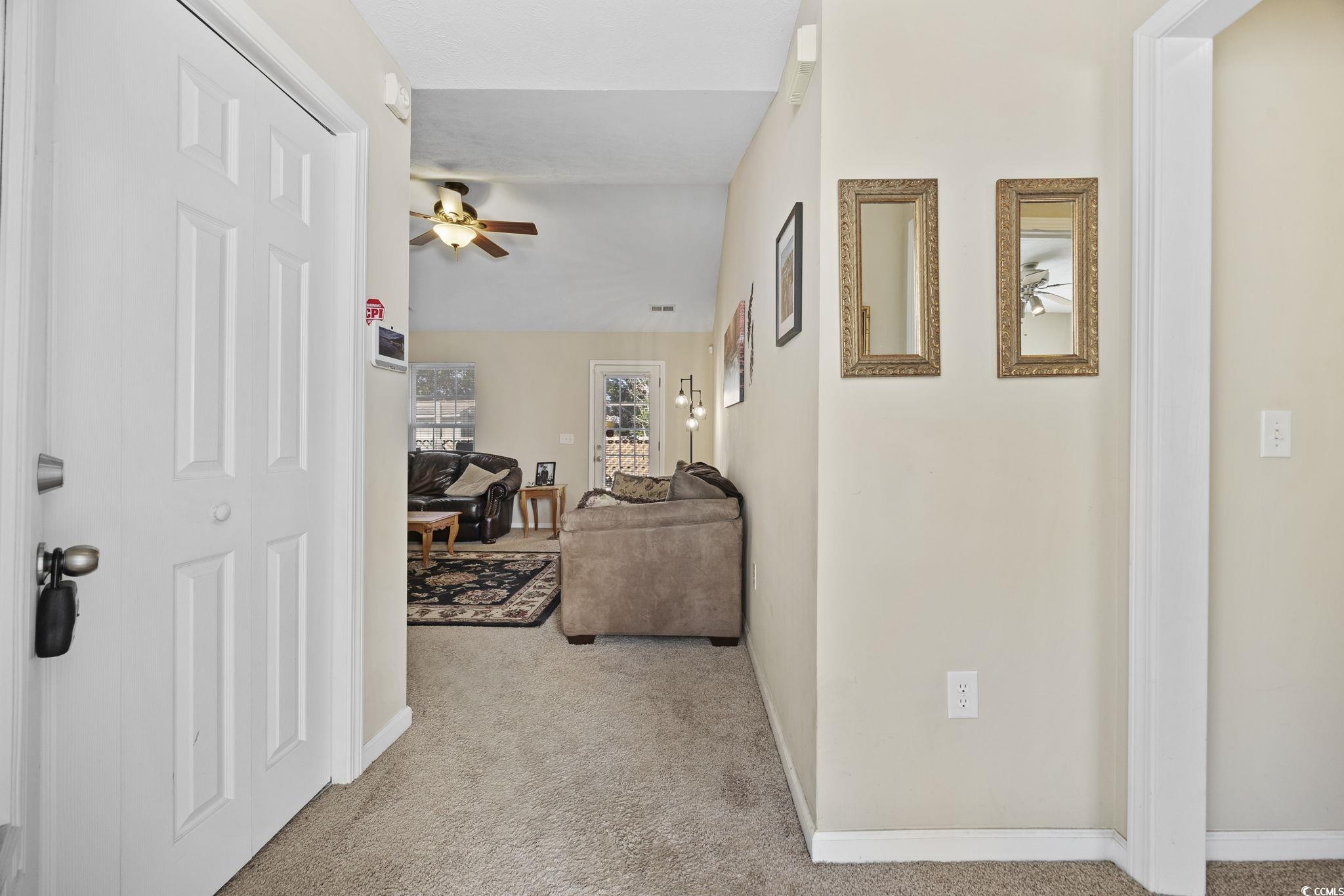 2902 Silverleaf Circle Loris, SC 29569 - Photo 3 of 38 Corridor with light carpet