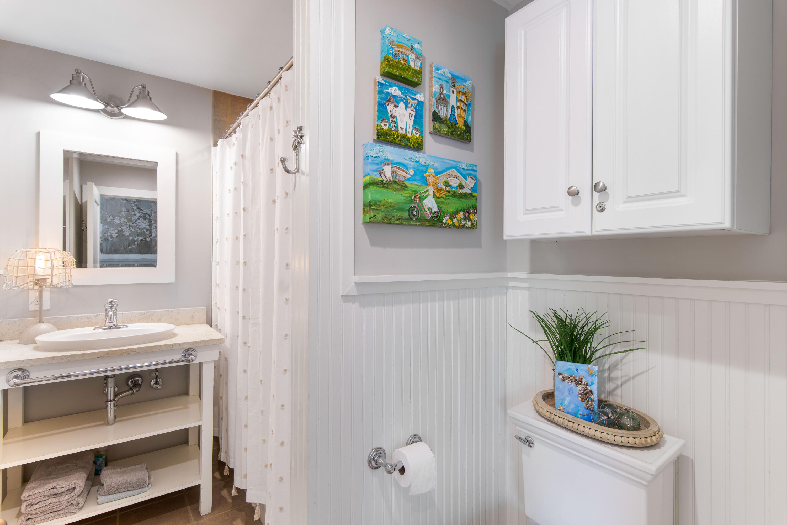 260 Salt Inlet Beach Inlet Beach, FL 32461 - Photo 13 of 39 a bathroom with a sink a vanity and a mirror