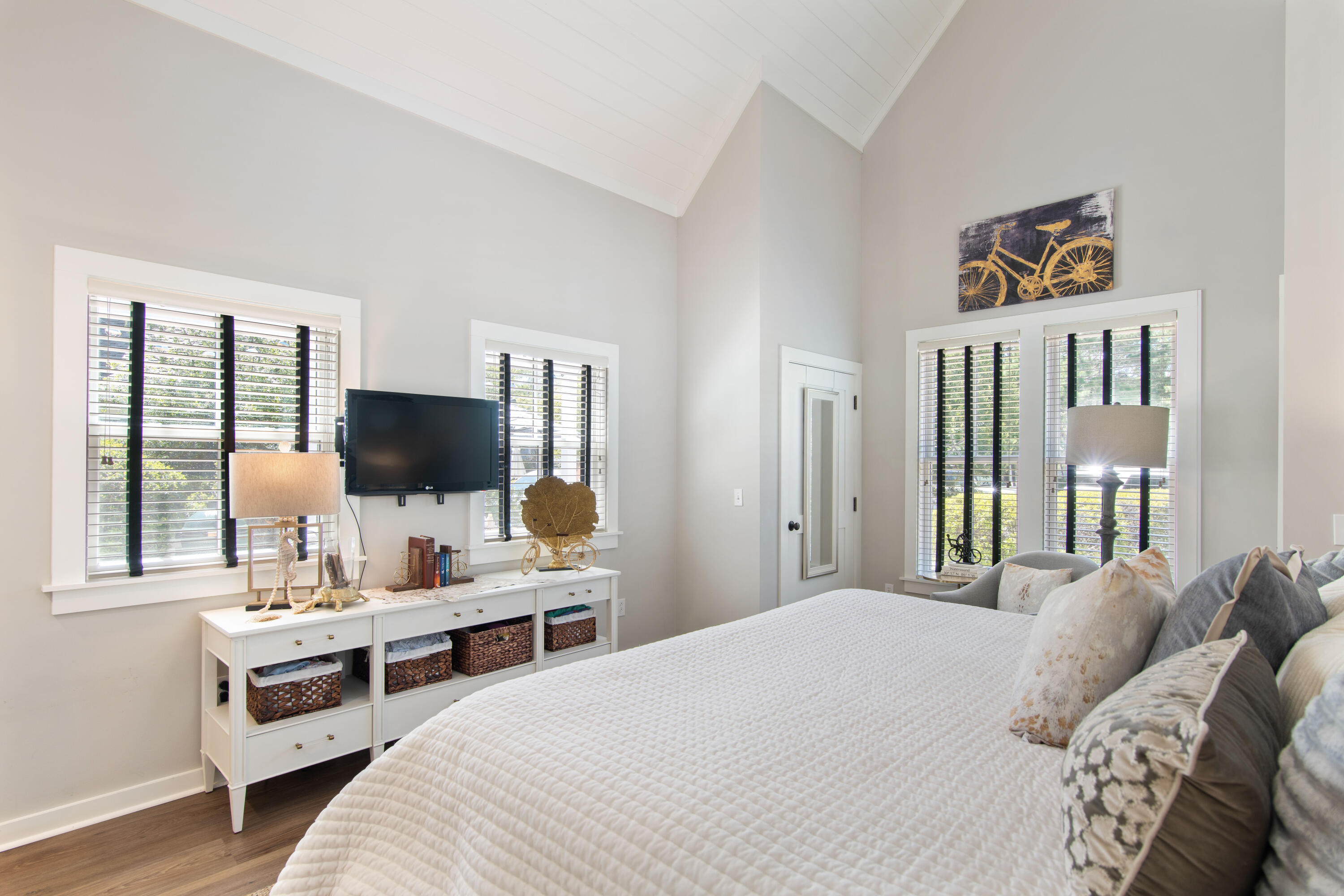 260 Salt Inlet Beach Inlet Beach, FL 32461 - Photo 17 of 39 a bedroom with a bed and a flat screen tv
