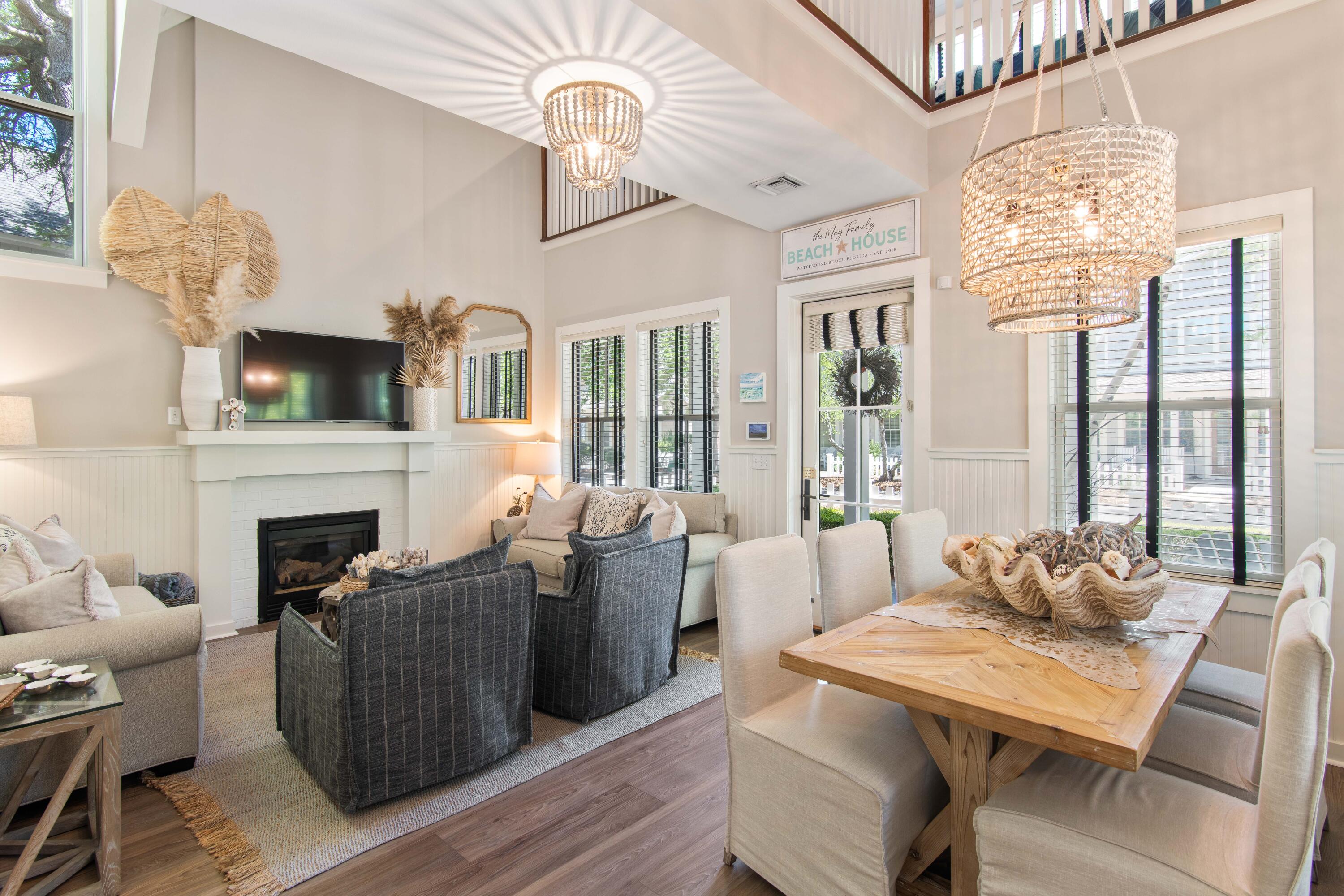260 Salt Inlet Beach Inlet Beach, FL 32461 - Photo 2 of 39 a living room with furniture chandelier and a fireplace