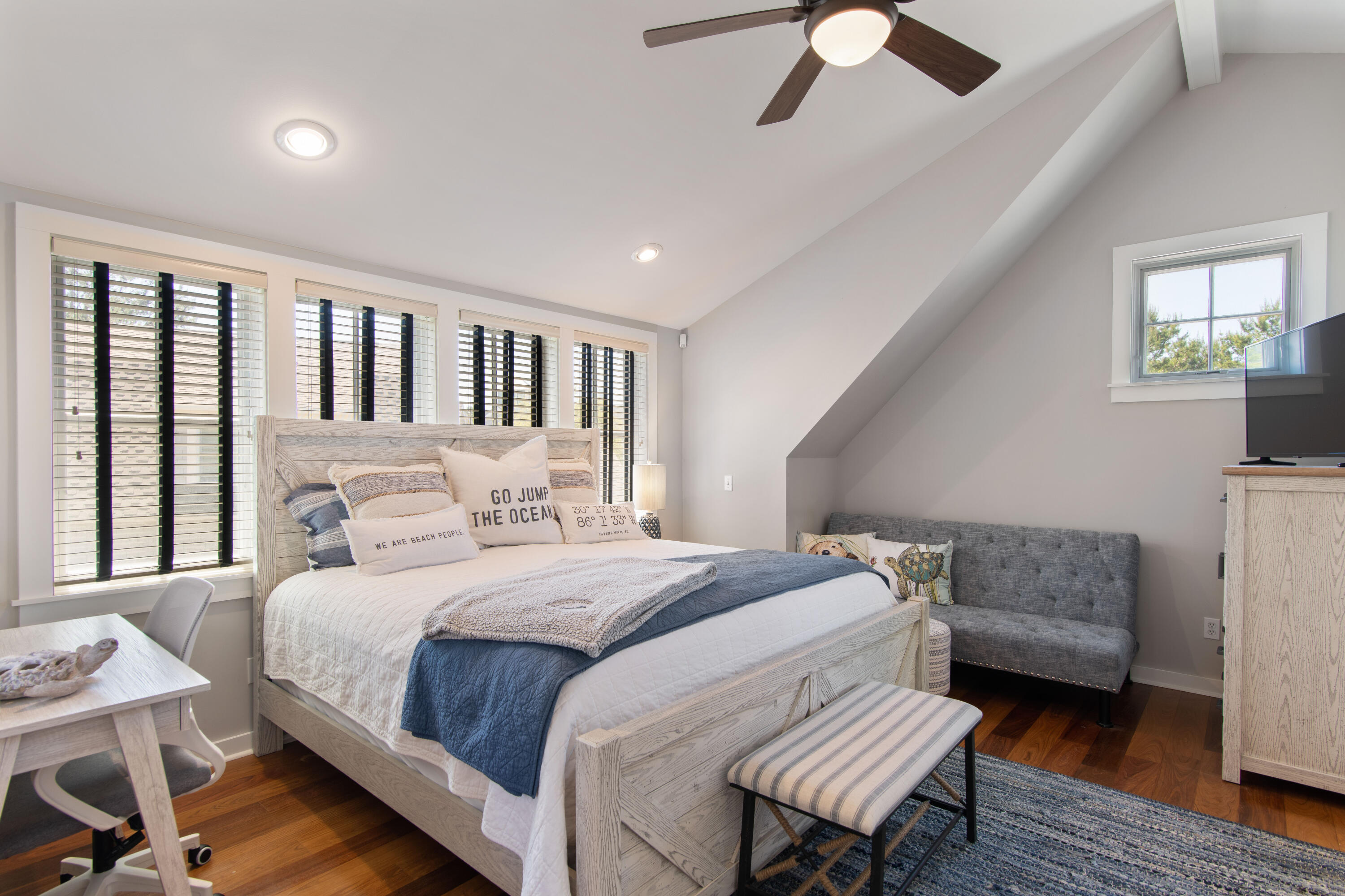 260 Salt Inlet Beach Inlet Beach, FL 32461 - Photo 24 of 39 a bedroom with a bed wooden floor and a chandelier