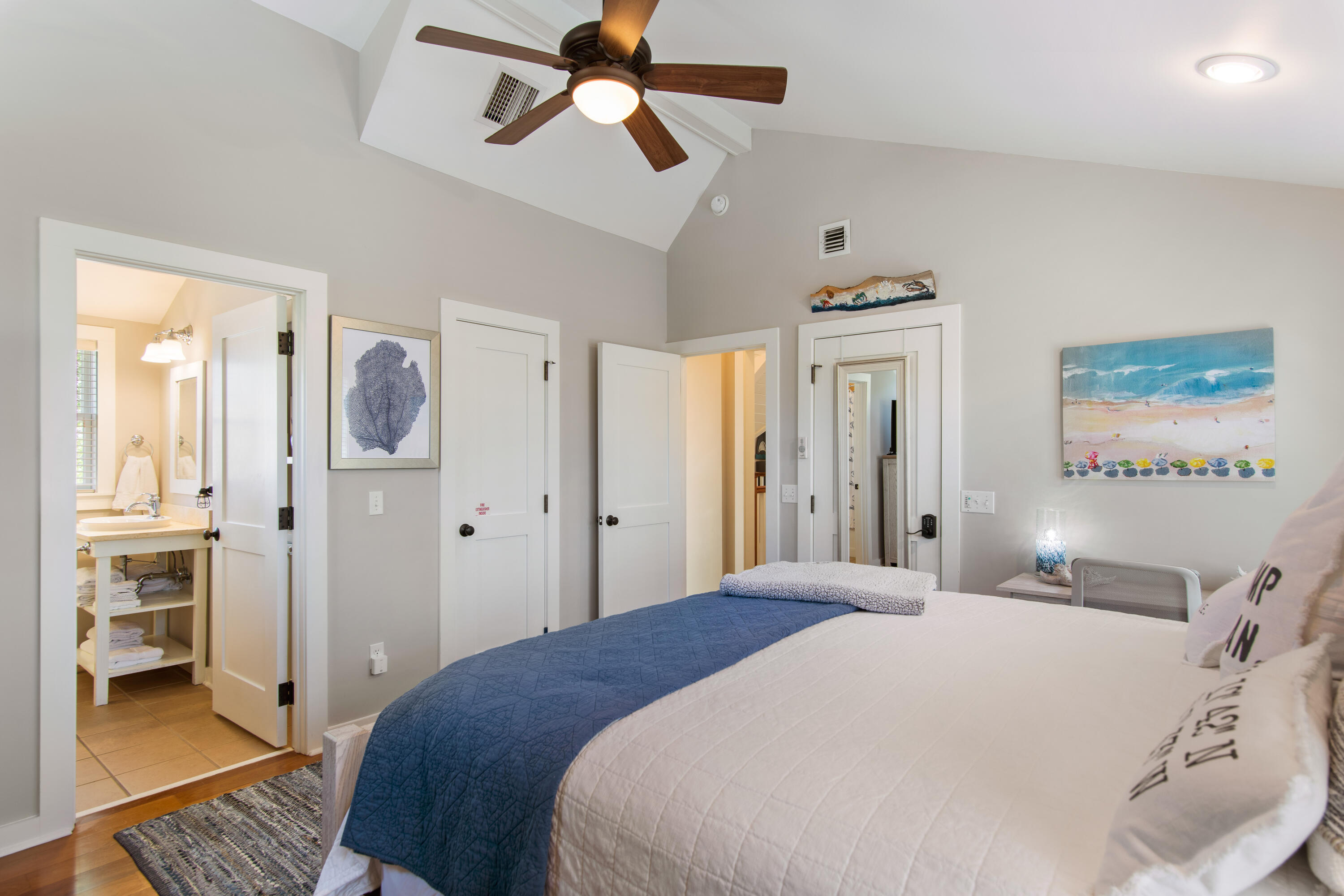 260 Salt Inlet Beach Inlet Beach, FL 32461 - Photo 25 of 39 a bedroom with a bed and a chandelier