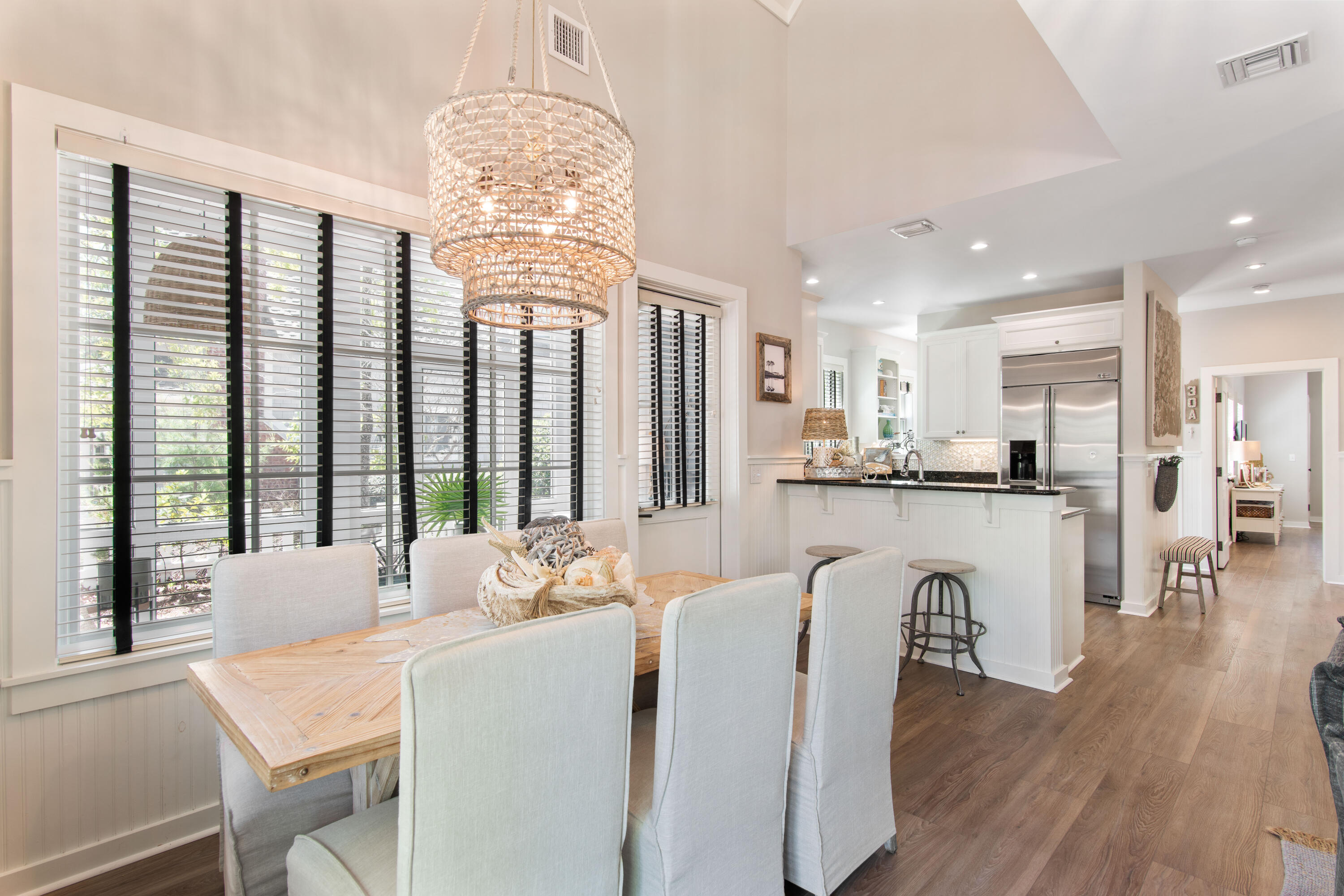 260 Salt Inlet Beach Inlet Beach, FL 32461 - Photo 5 of 39 a dining room with furniture a chandelier and wooden floor