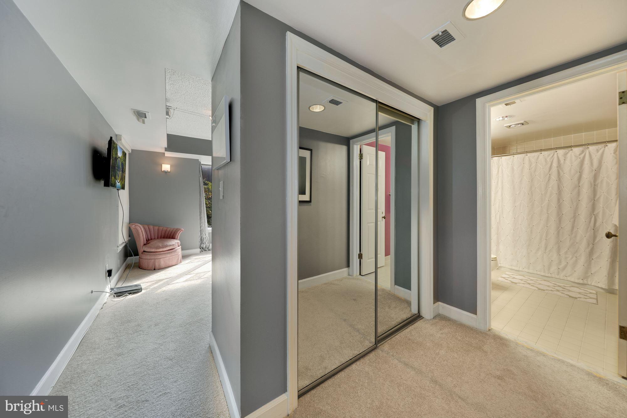 1080 Wisconsin Avenue Northwest, Unit 2001 Washington, DC 20007 - Photo 18 of 27 Large Closet with Mirrors in Master Bedroom