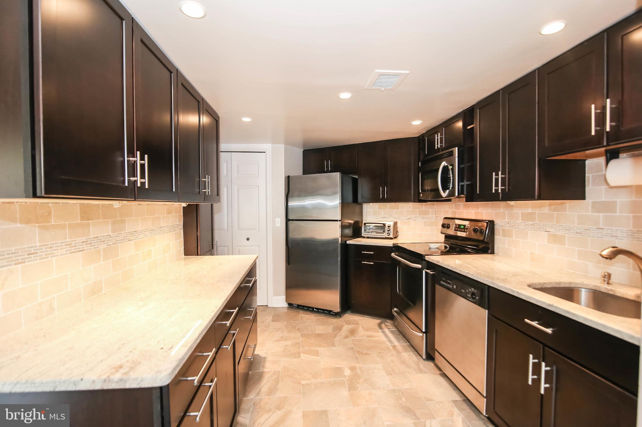 1080 Wisconsin Avenue Northwest, Unit 2001 Washington, DC 20007 - Photo 5 of 27 Beautiful Kitchen with Stainless & Granite