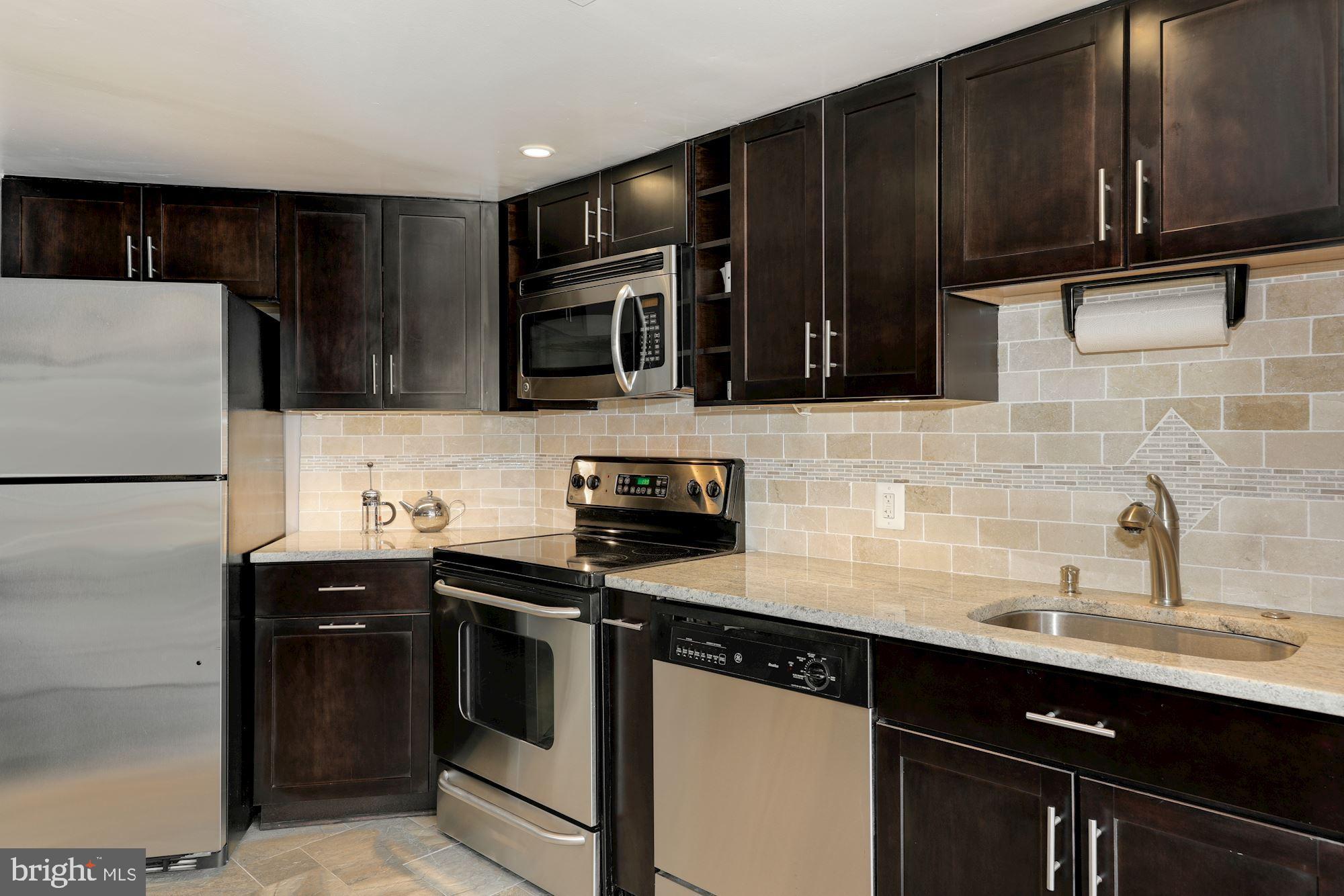 1080 Wisconsin Avenue Northwest, Unit 2001 Washington, DC 20007 - Photo 6 of 27 Kitchen with Ample Cabinets & Counter Space
