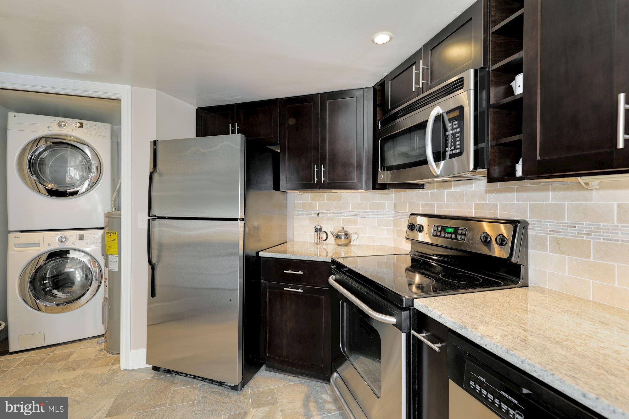 1080 Wisconsin Avenue Northwest, Unit 2001 Washington, DC 20007 - Photo 8 of 27 Kitchen with Washer & Dryer