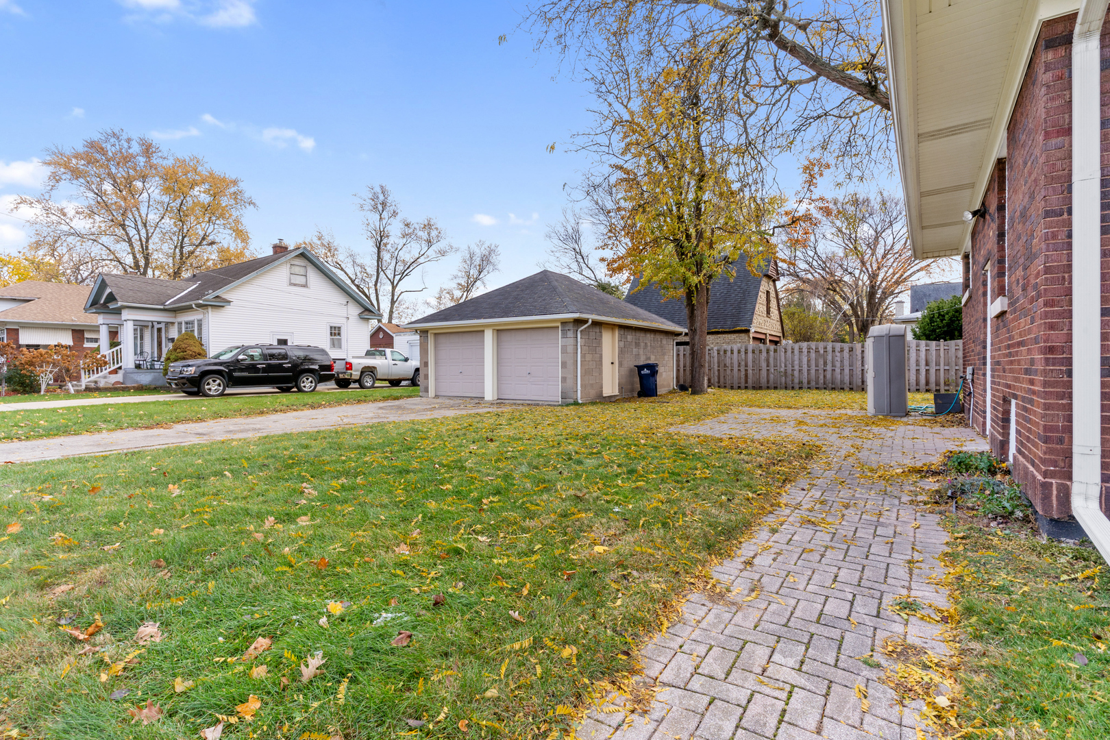 407 North Liberty Street Elgin, IL 60120 - Photo 16 of 18 a front view of a house with a yard