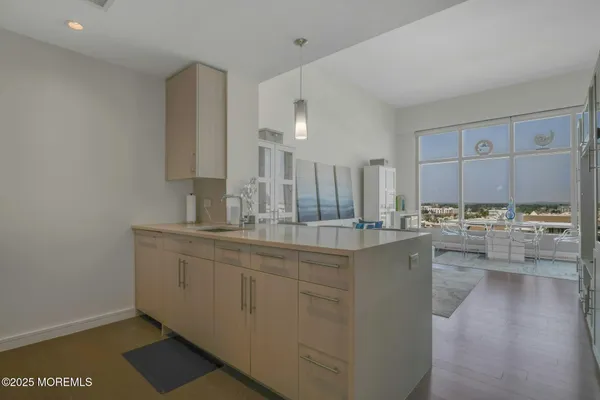 a kitchen with counter top space and sink
