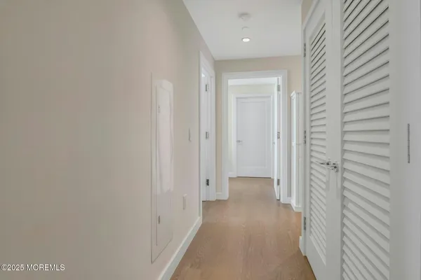 a view of an entryway with wooden floor