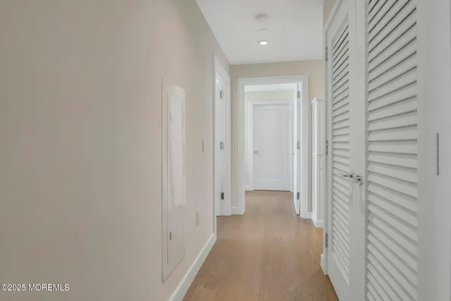 a view of an entryway with wooden floor