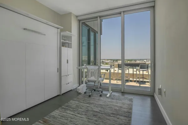 a bedroom with a bed and a table