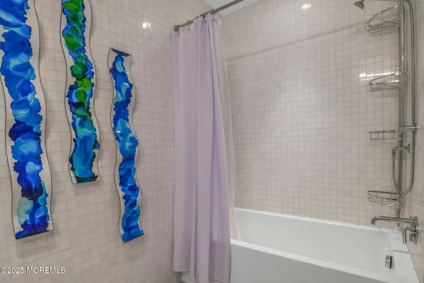 a bedroom with a bed and large window