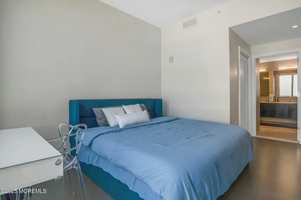 a bathroom with a tub and shower