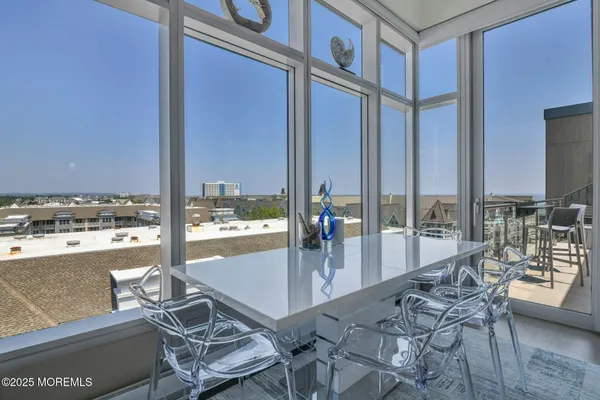 a view of a floor to ceiling window and an outdoor kitchen