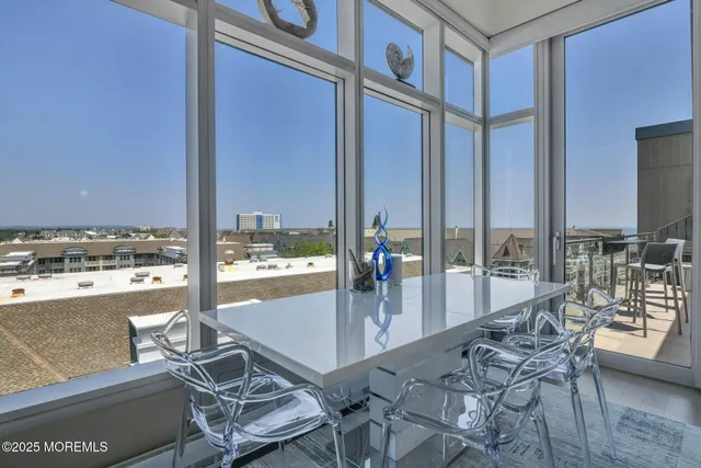 a view of a floor to ceiling window and an outdoor kitchen