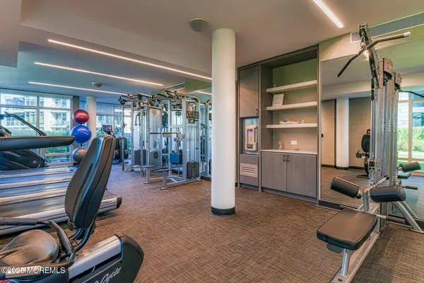 a kitchen with kitchen island a sink table and chairs