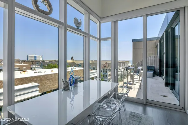 a view of a living room and entry way