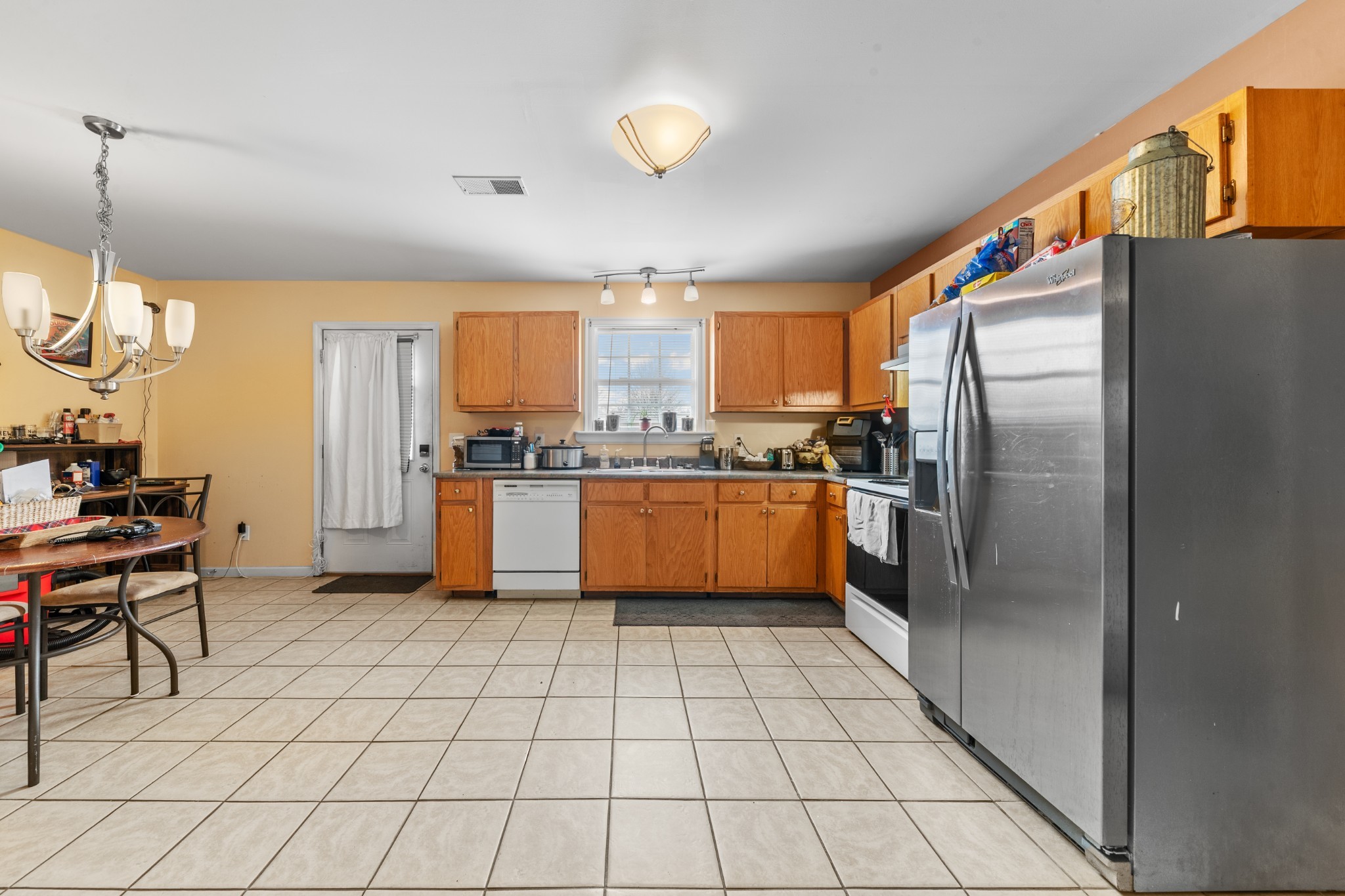 1916 Word Road Lewisburg, TN 37091 - Photo 14 of 69 a kitchen with stainless steel appliances granite countertop a refrigerator and a stove top oven