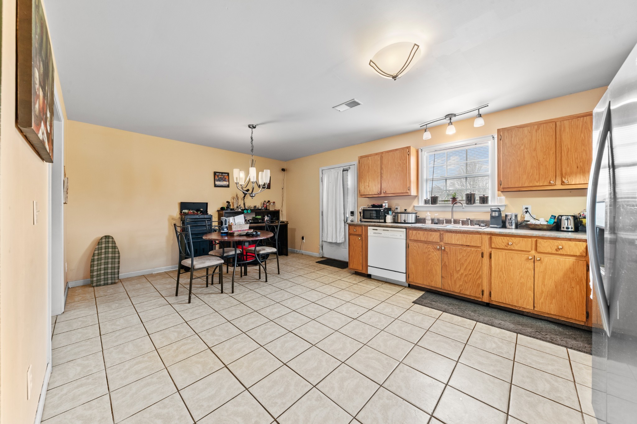 1916 Word Road Lewisburg, TN 37091 - Photo 15 of 69 a kitchen with a sink dining table and chairs