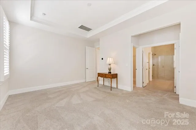 an empty room with table and chair