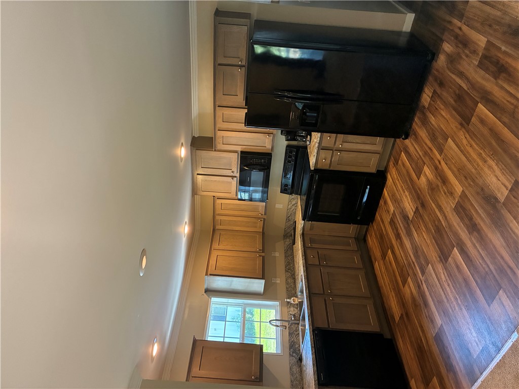 125 Ricks Road Fair Play, SC 29643 - Photo 5 of 26 Warm wood cabinetry and laminate countertops pair with recessed lighting in this kitchen.