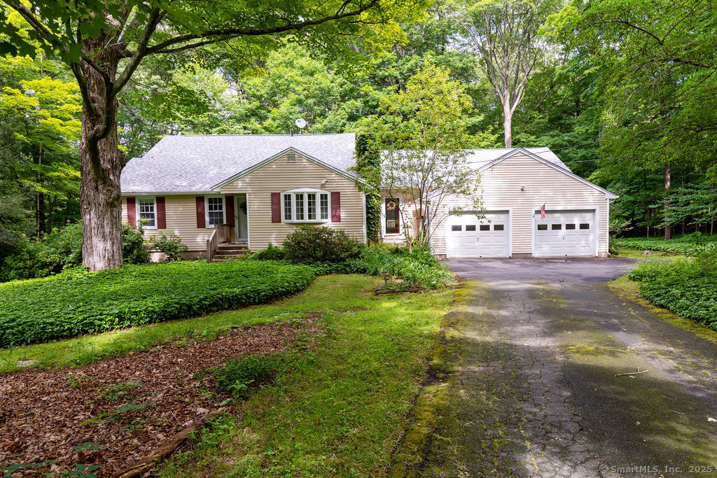 169 Wheeling Road Andover, CT 06232 - Photo 1 of 1 a front view of a house with garden